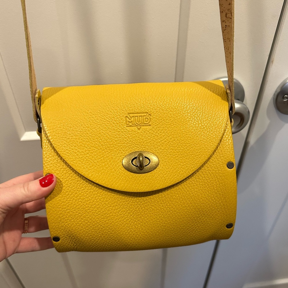 Manufacture by Design (MUD) bag crafted in Portugal of leather, cork, and wood